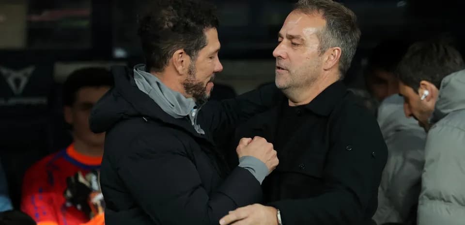 Coaches greeting each other before the match