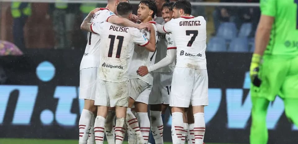 AC Milan players celebrating a goal together