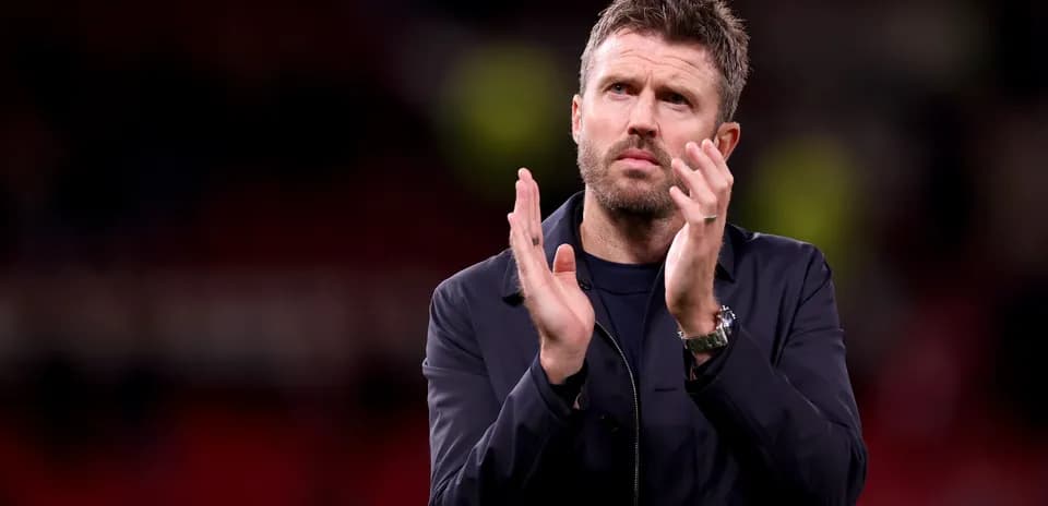 Man applauding on the pitch after a match