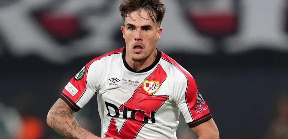 Player in Rayo Vallecano kit running during match