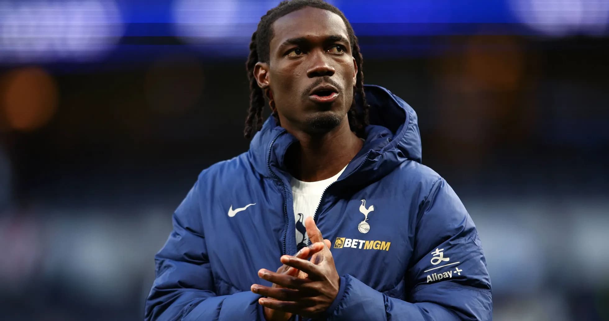 Player in Tottenham jacket preparing for match