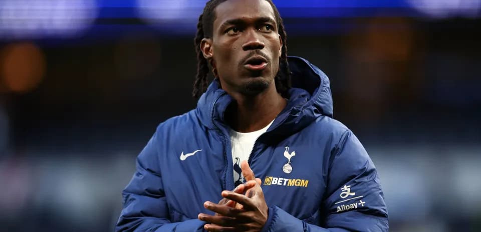 Player in Tottenham jacket preparing for match