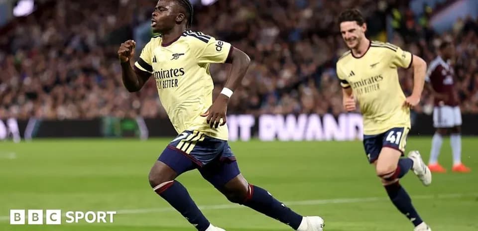 Player celebrating goal with teammate during match
