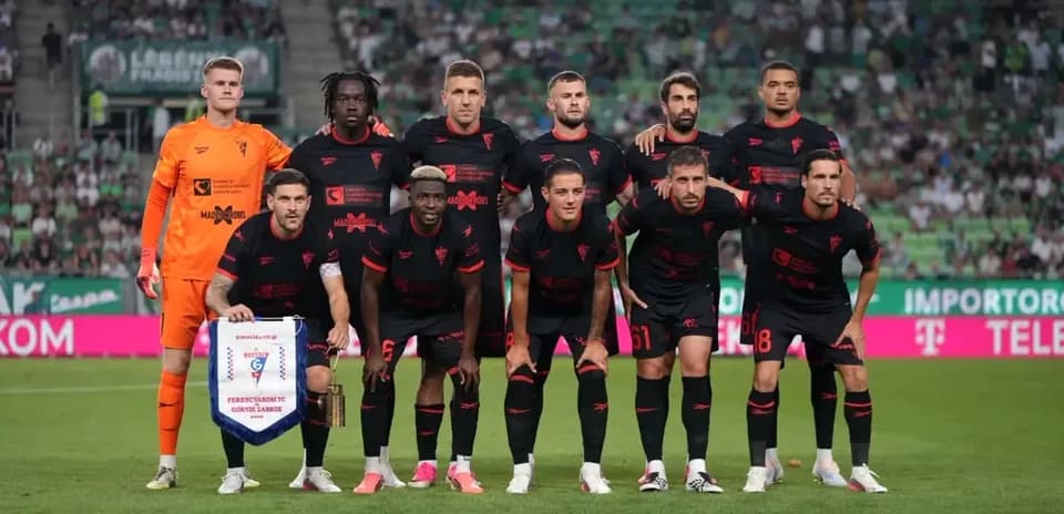 Football team posing before UEFA Europa League match