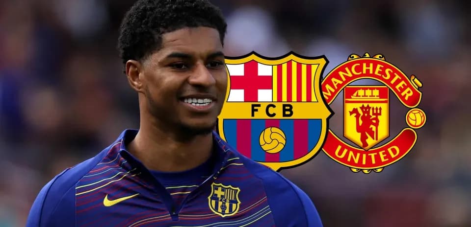 Player smiling in Barcelona kit with club logos