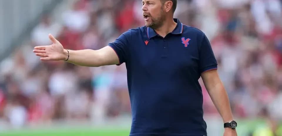 Coach giving instructions from the sidelines during match