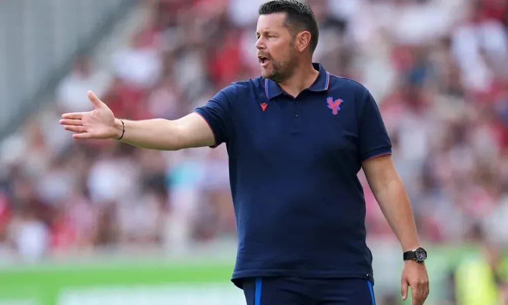 Coach giving instructions from the sidelines during match