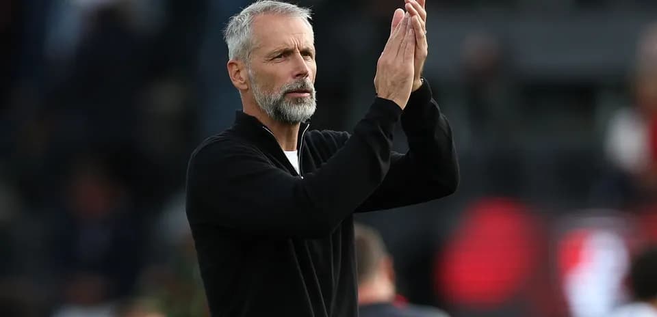Coach applauding during a match or training session