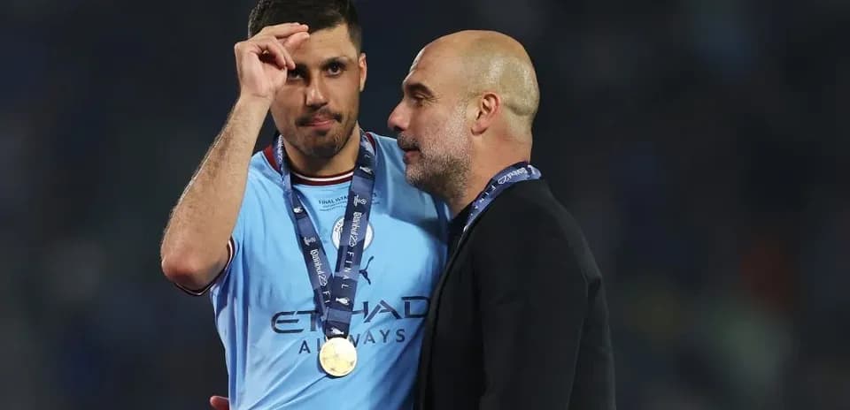 Player and manager celebrating post-match with medals