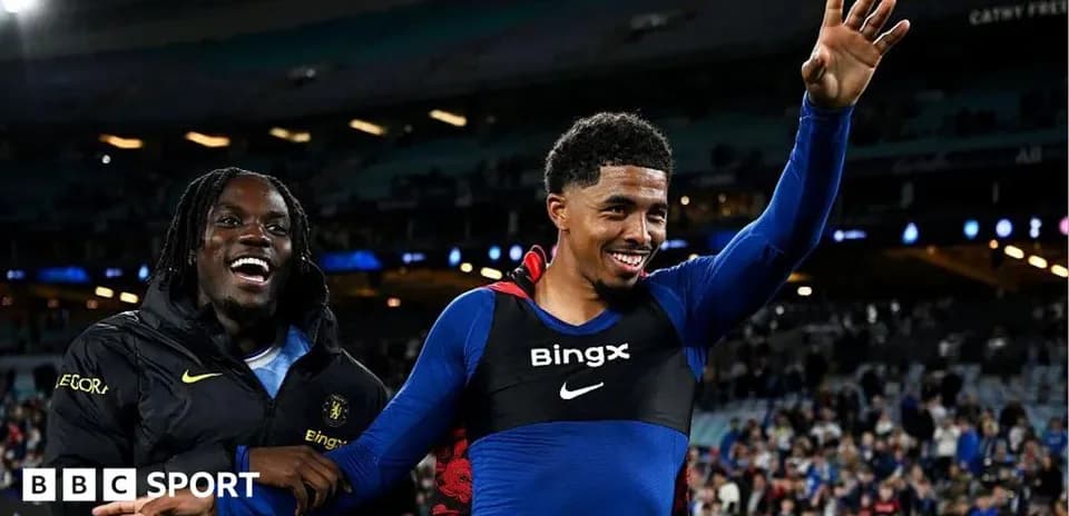Two players celebrating on the field after match