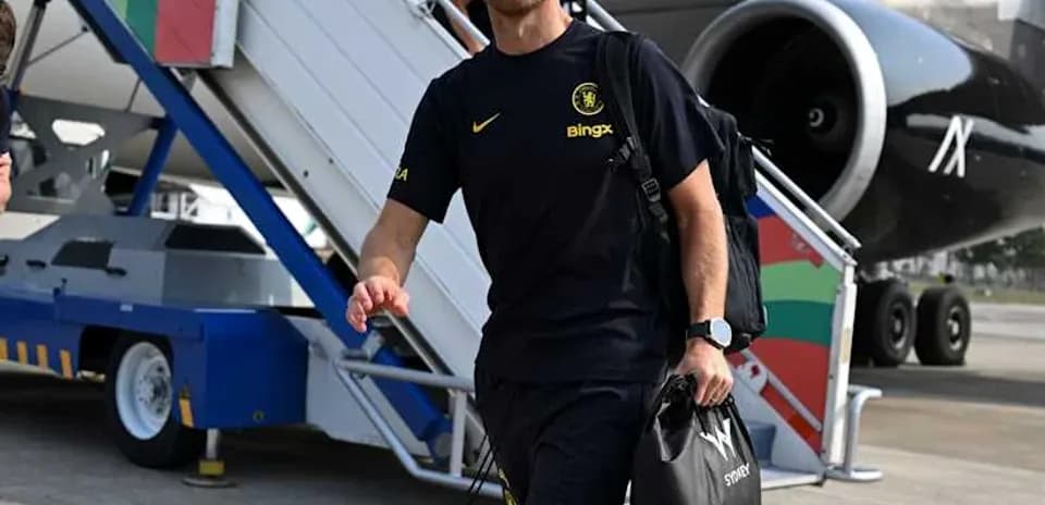 Man in sportswear walking towards airplane at airport