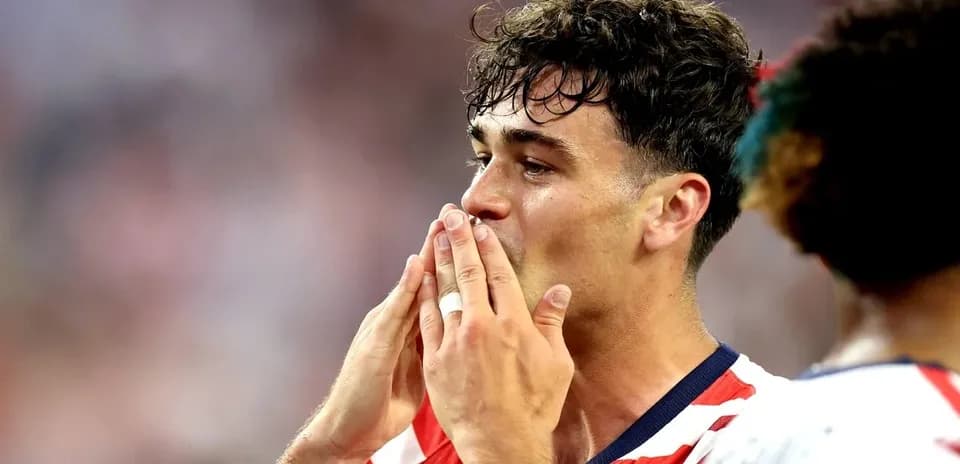 Player celebrating with hands to face after match