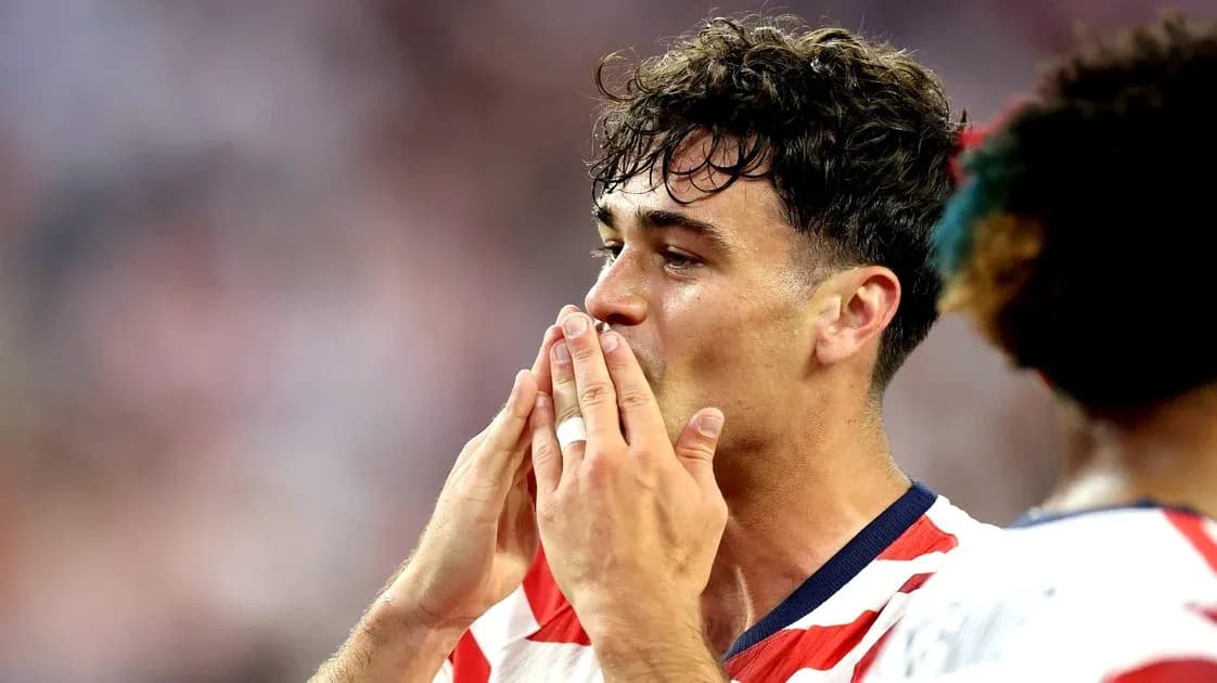 Player celebrating with hands to face after match