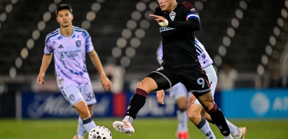 Player dribbling the ball during MLS match