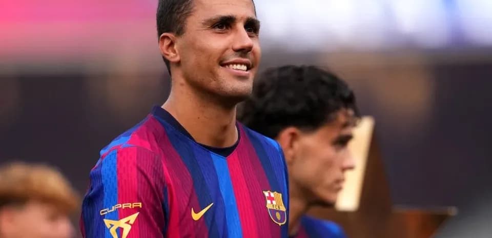 Player smiling in FC Barcelona jersey during event