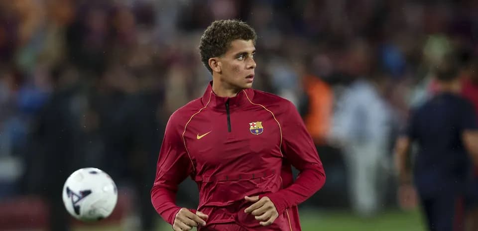 Player warming up on pitch before the match