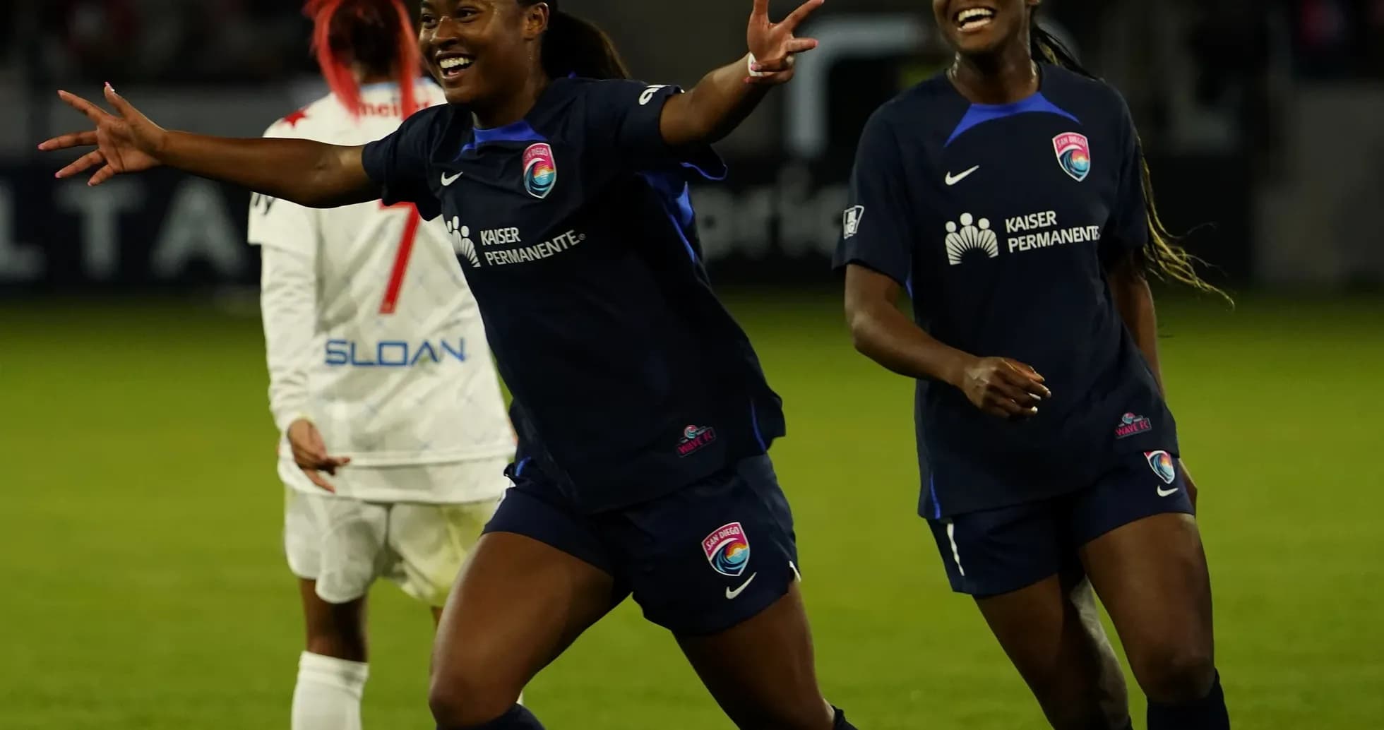Players celebrating after a goal during match
