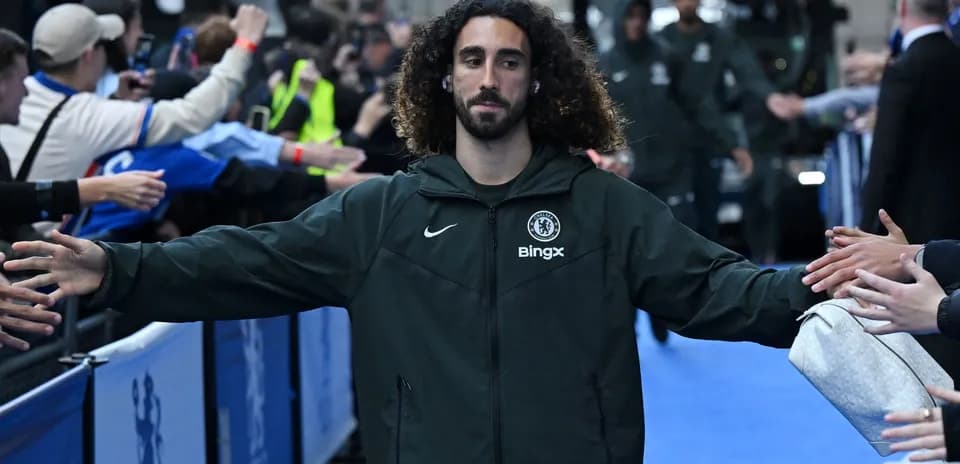 Player greeting fans in Chelsea training area