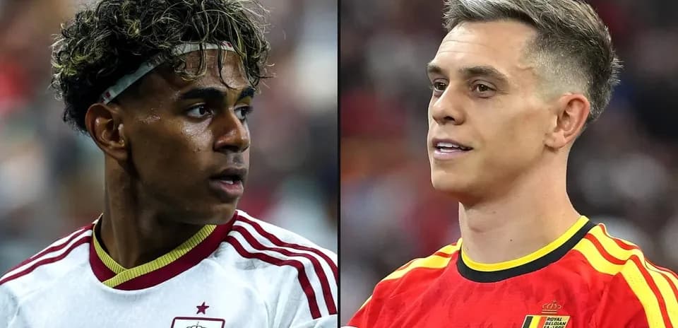 Two soccer players from Spain and Belgium facing each other