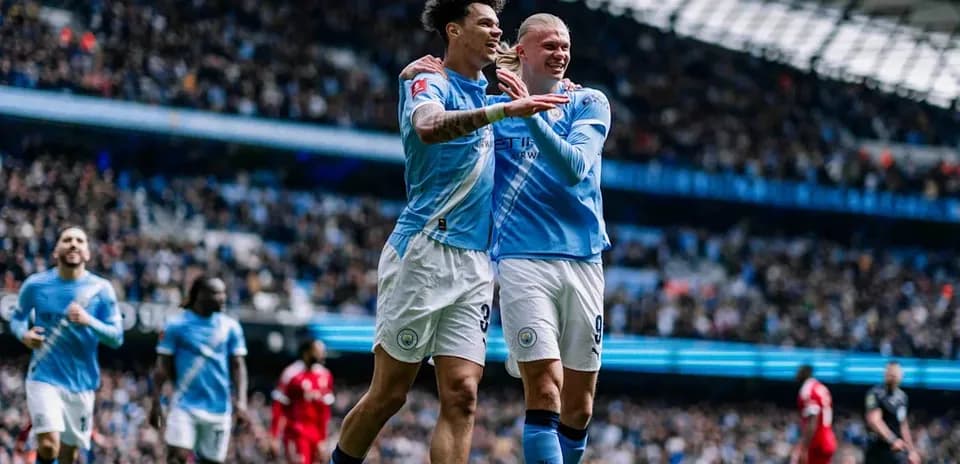 Manchester City players celebrating a goal during match