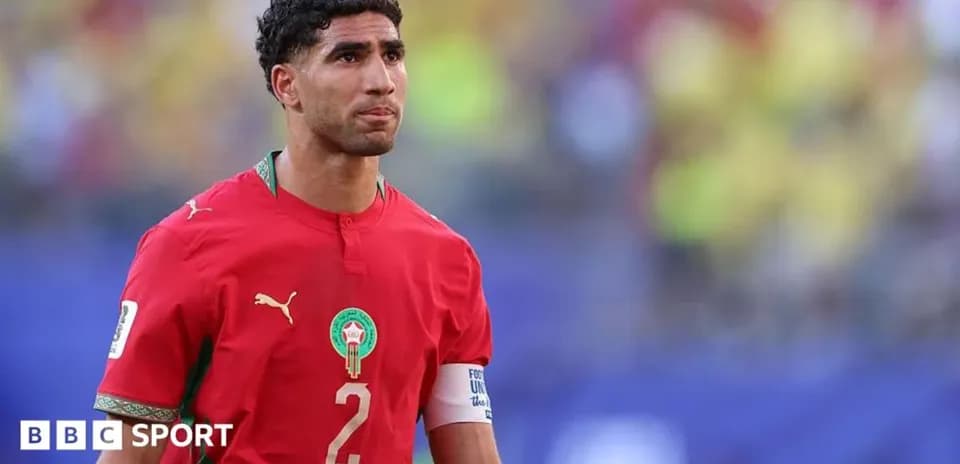 Moroccan player wearing red jersey on the field