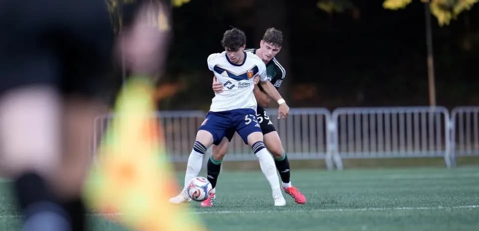 Players battling for possession during match