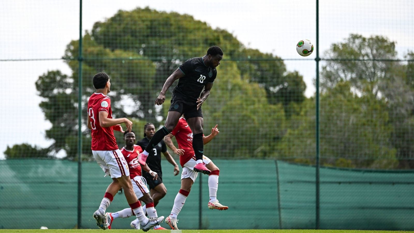 Player jumping to head the ball during training