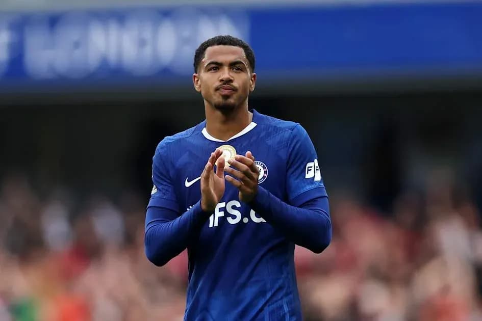 Player applauding fans wearing blue team jersey