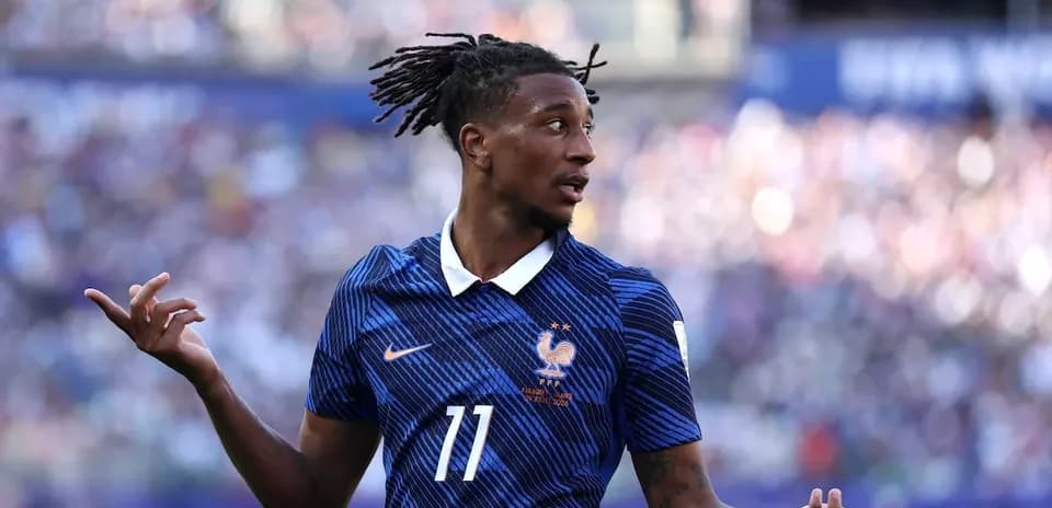 Player gesturing during a football match for France