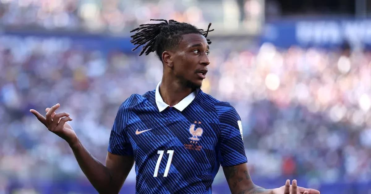 Player gesturing during a football match for France