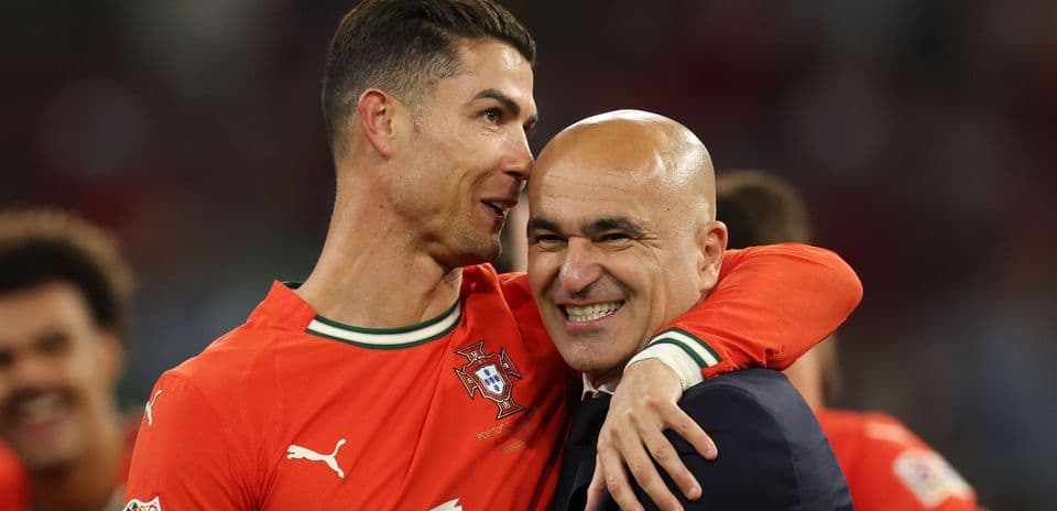 Cristiano Ronaldo embracing coach after match victory