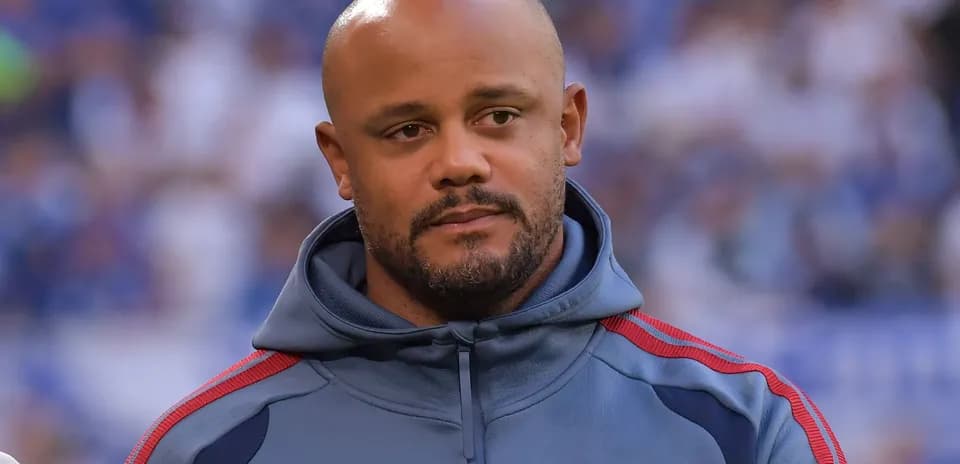 Man in gray hoodie standing on the field