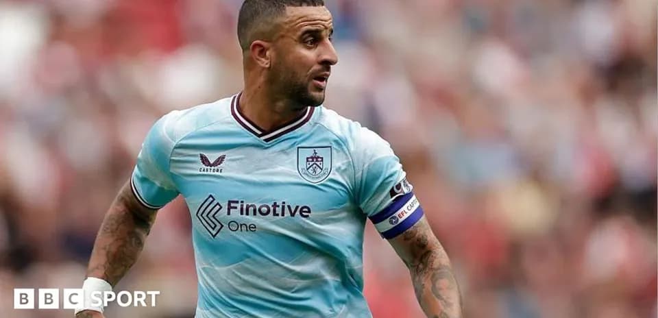 Player in light blue kit running on the pitch