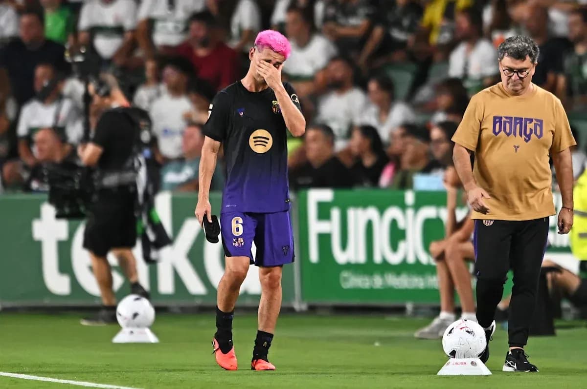 Player with pink hair walking off field, coach beside Player with pink hair walking off field, coach beside