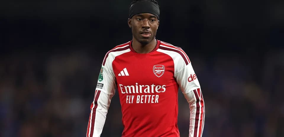 Player in Arsenal kit during match action