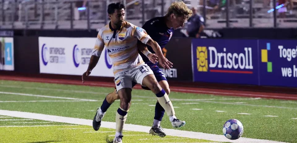 Player competing for the ball during match