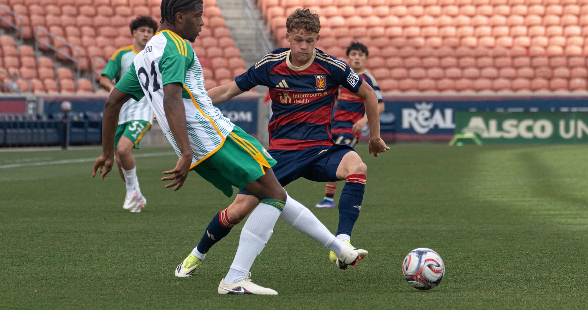 Players competing for the ball during match
