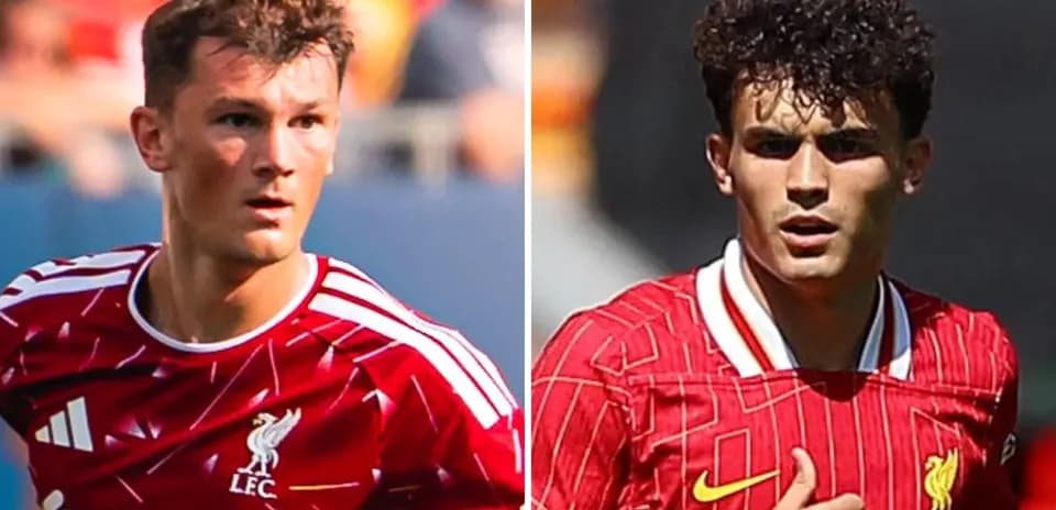 Two Liverpool players in red jerseys during match