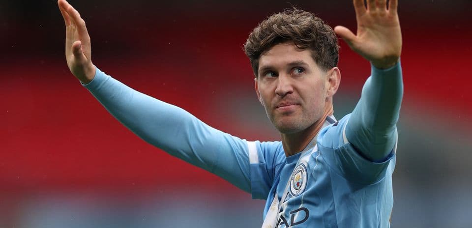 Player gesturing to fans in Manchester City kit