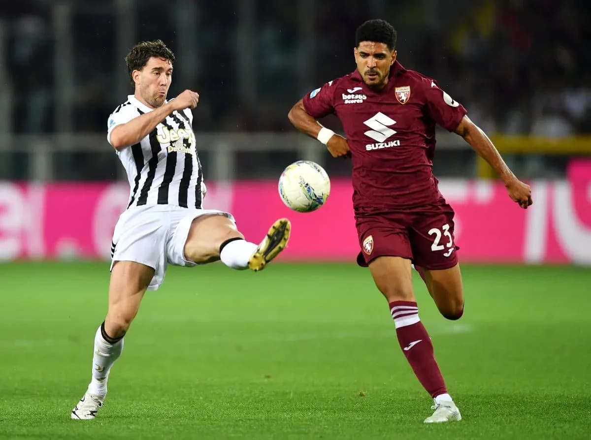 Player from Juventus kicking the ball against Torino