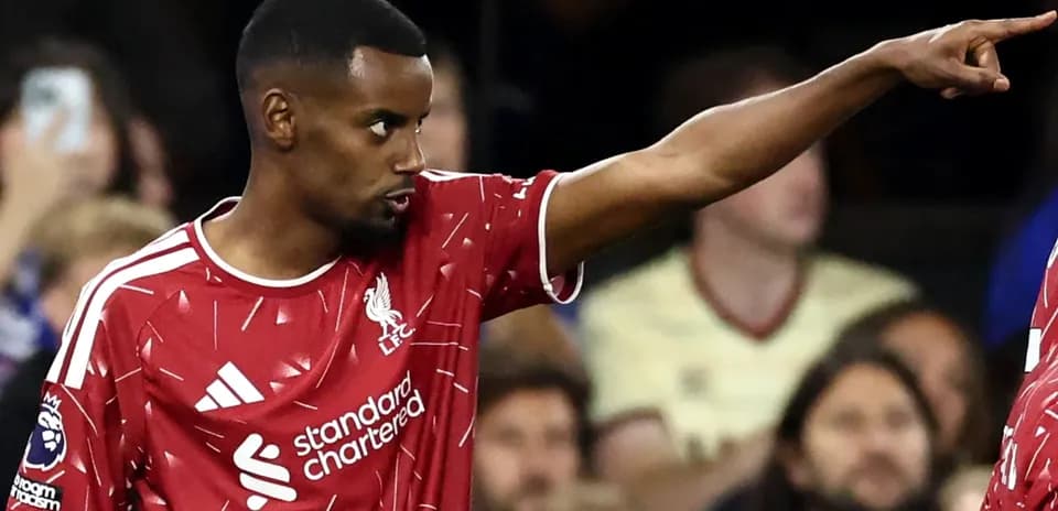 Liverpool player pointing during match action