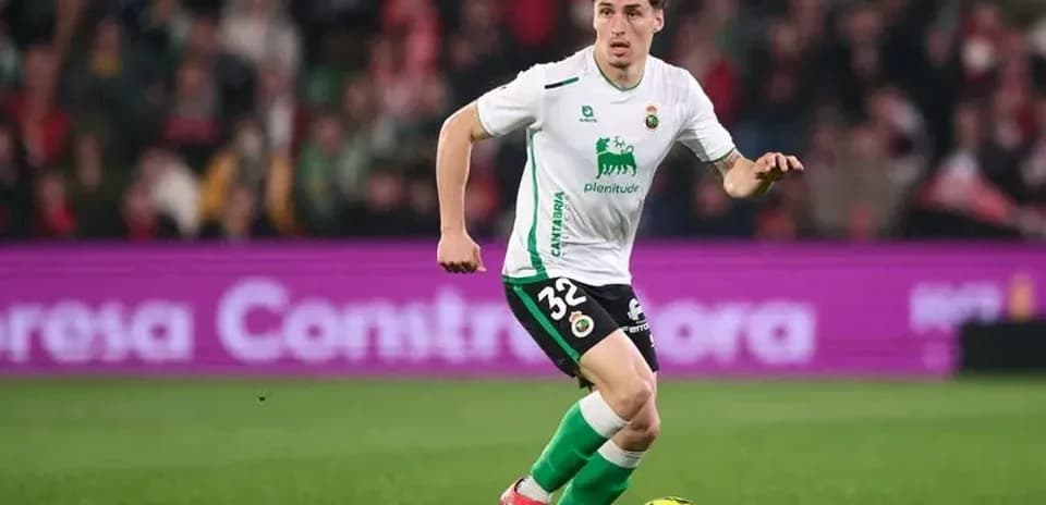 Player dribbling ball during a football match