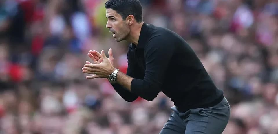 Manager gesturing during a football match on sideline