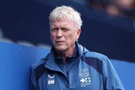 Manager observing from the sidelines during match