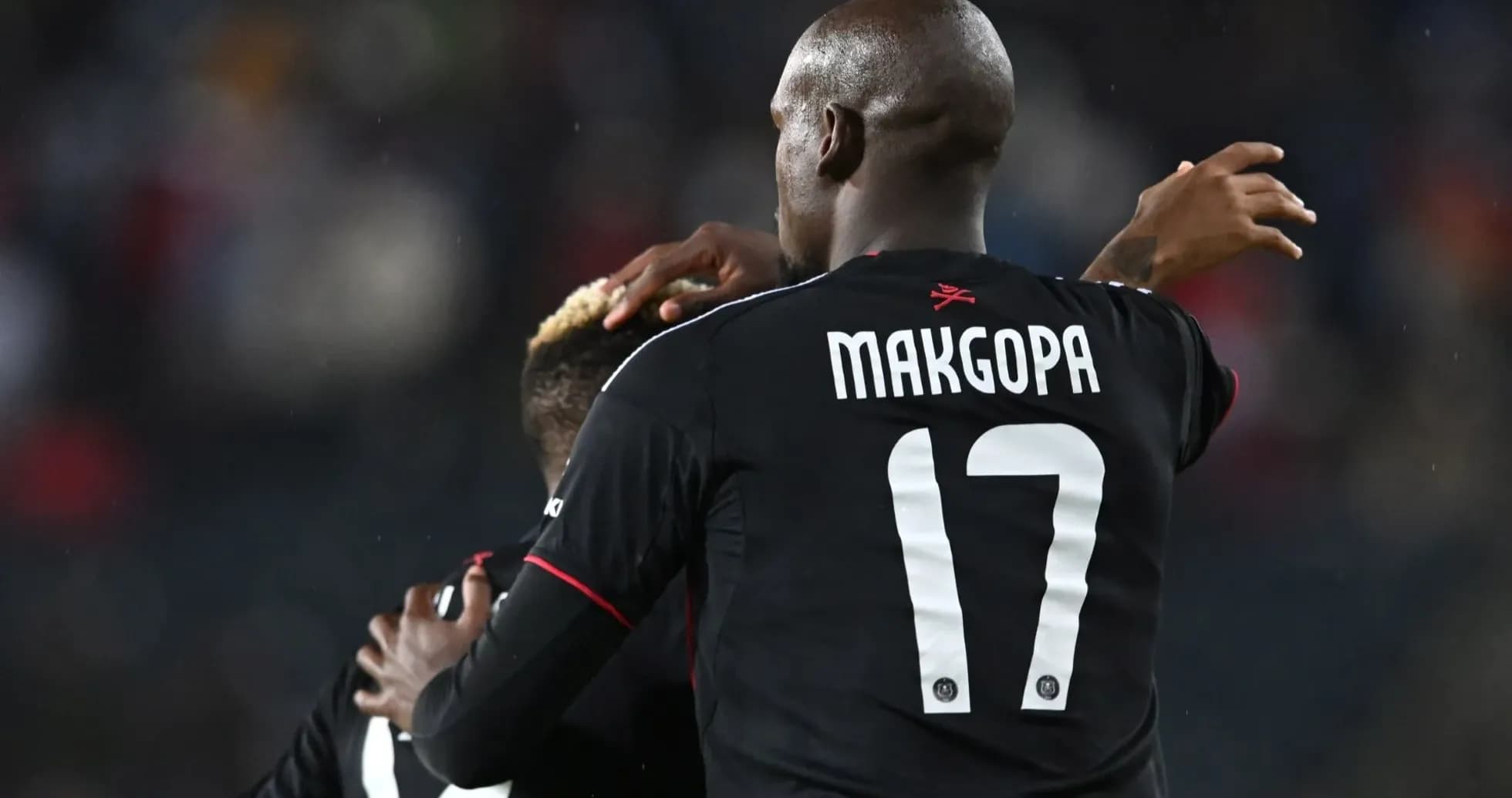 Players celebrating together after a goal