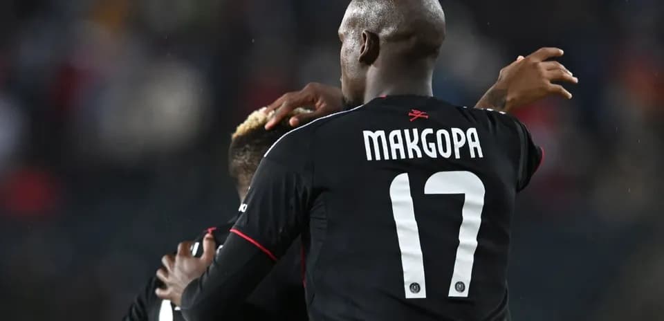 Players celebrating together after a goal