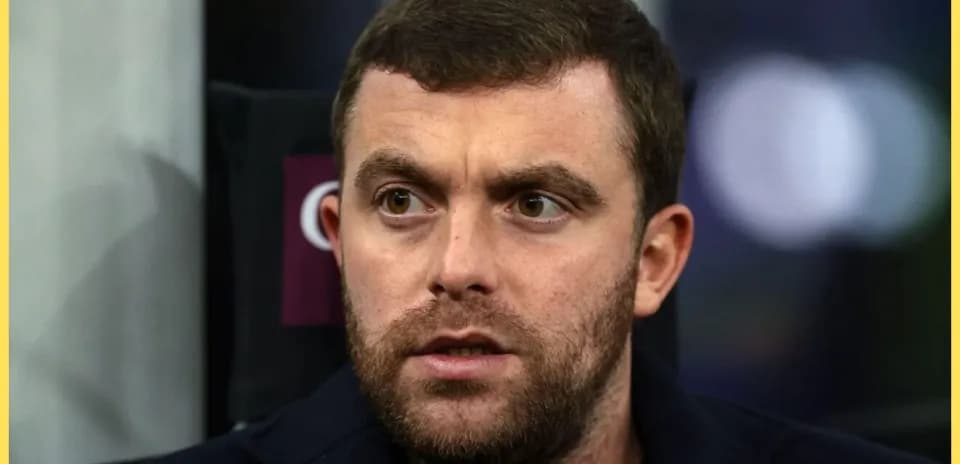 Close-up of a man with a beard looking intently