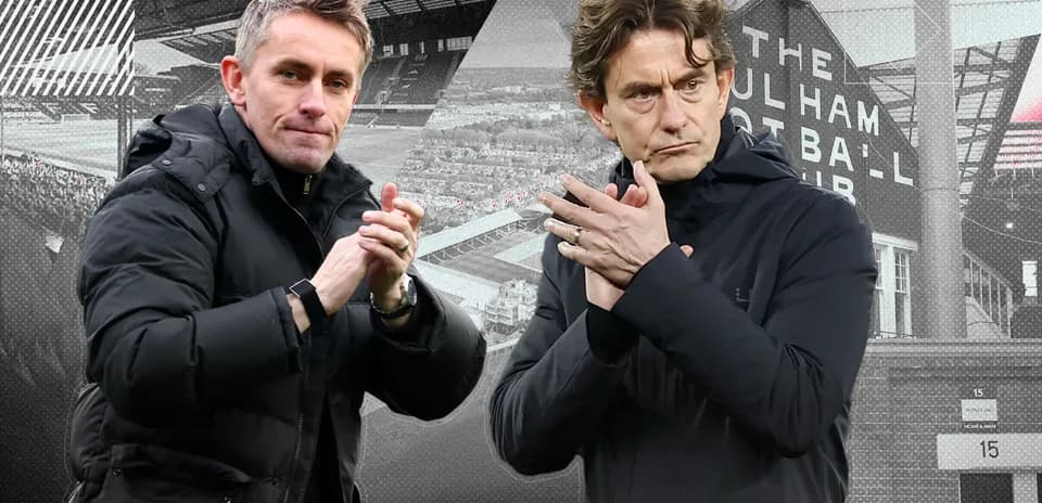 Two football managers clapping during a match