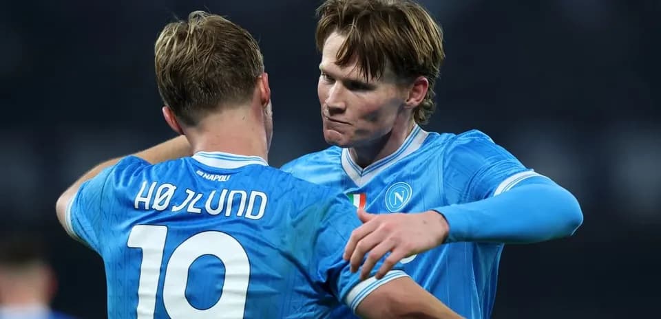 Two Napoli players celebrating after a match