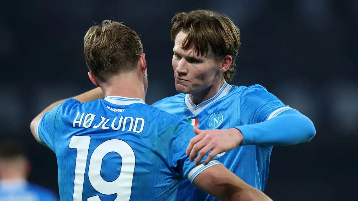 Two Napoli players celebrating after a match